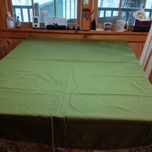 Green oval lace trimmed table cloth